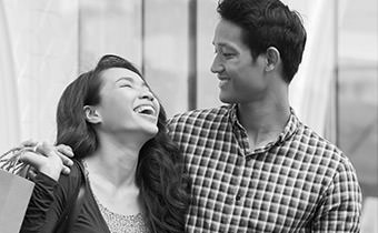 Black and white photo of couple laughing