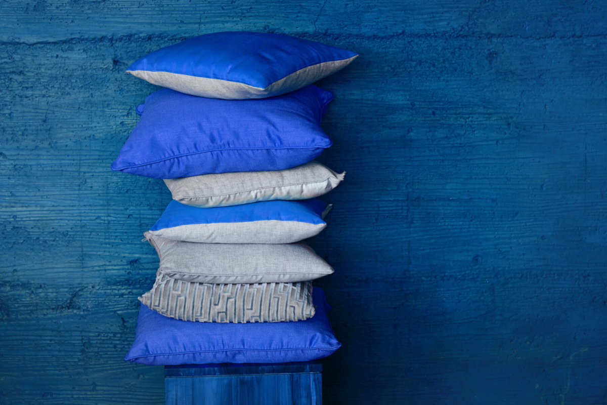 Stack of blue throw pillows