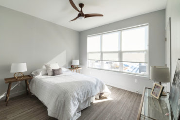 Master bedroom in our 2-bedroom townhome, with a spacious walk-in closet and luxurious en suite bathroom.