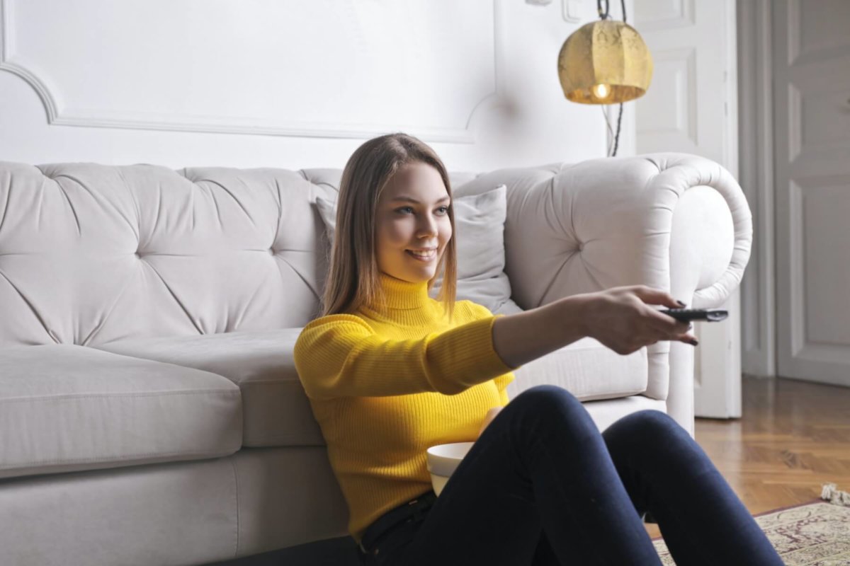 Young woman watching television