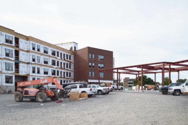 A view of the back of Building D, with the beam work beginning on Building C