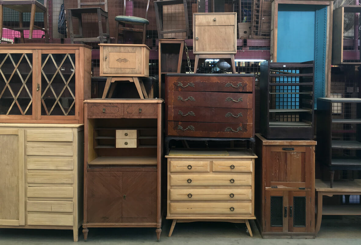 Stack of used furniture in a thrift store