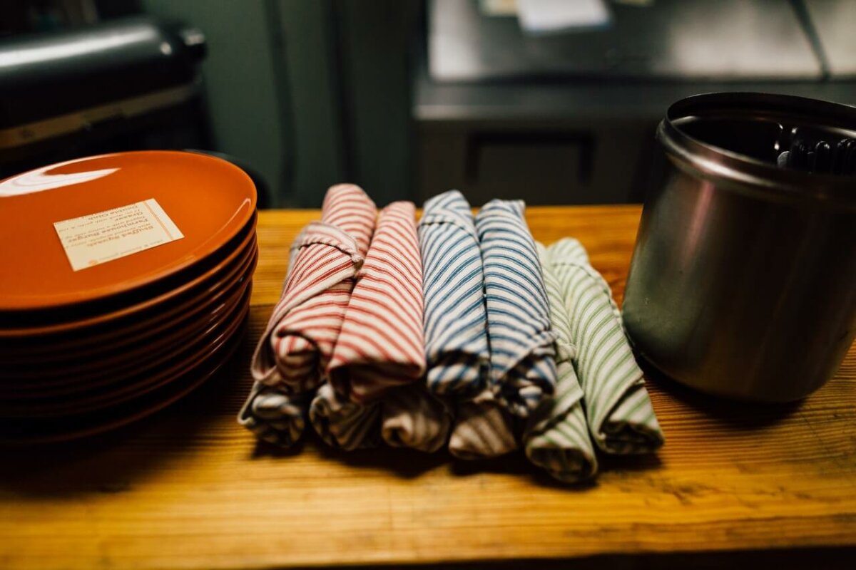 Kitchen towels and plates on a counter. Photo credit: Kelly Lacy