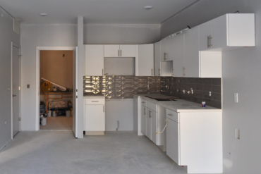 The kitchen cabinets are installed and the appliances are next in this one-bedroom apartment (Unit 1C) in Building B.
