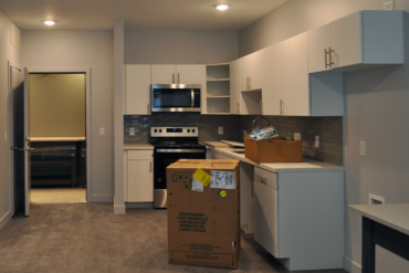 Appliances are being installed in this one-bedroom apartment (unit 1C) in Building A.