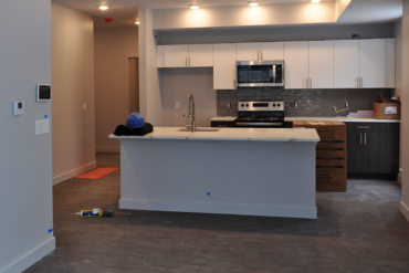 Things are coming together with the kitchen in this two-bedroom apartment (unit 2D) in Building A.