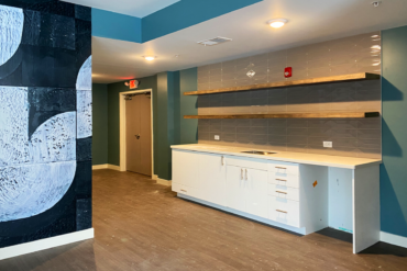The community room in Building A is really coming together. It includes a kitchenette, which makes it great for resident events.