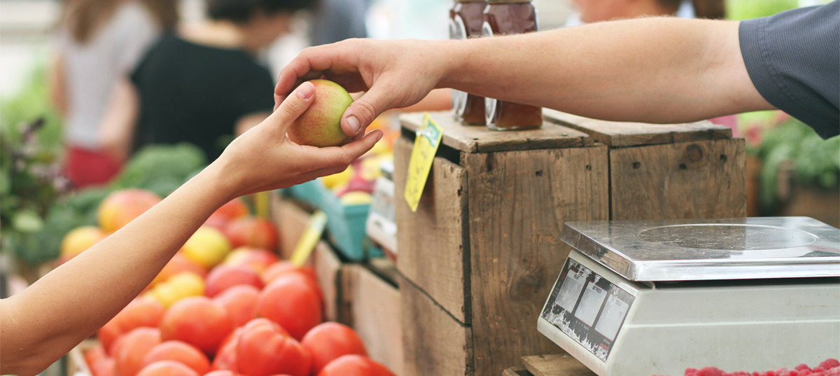 Person shopping at a farmers market