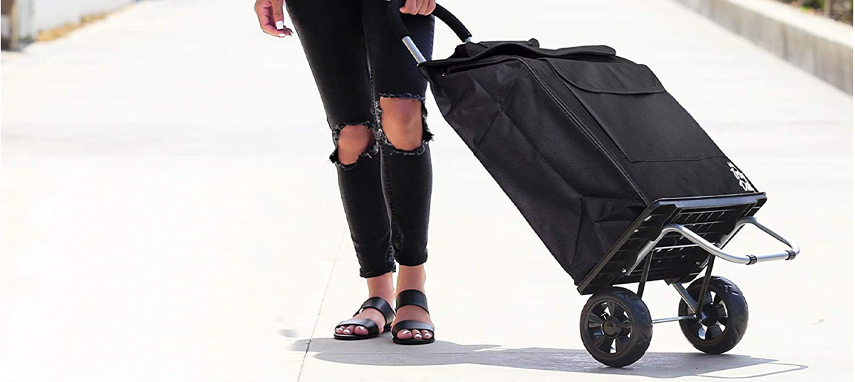 Woman pulling a rolling cart