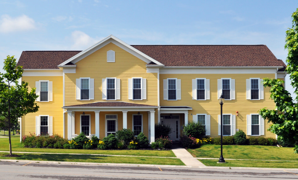 A yellow house at Erie Station Village