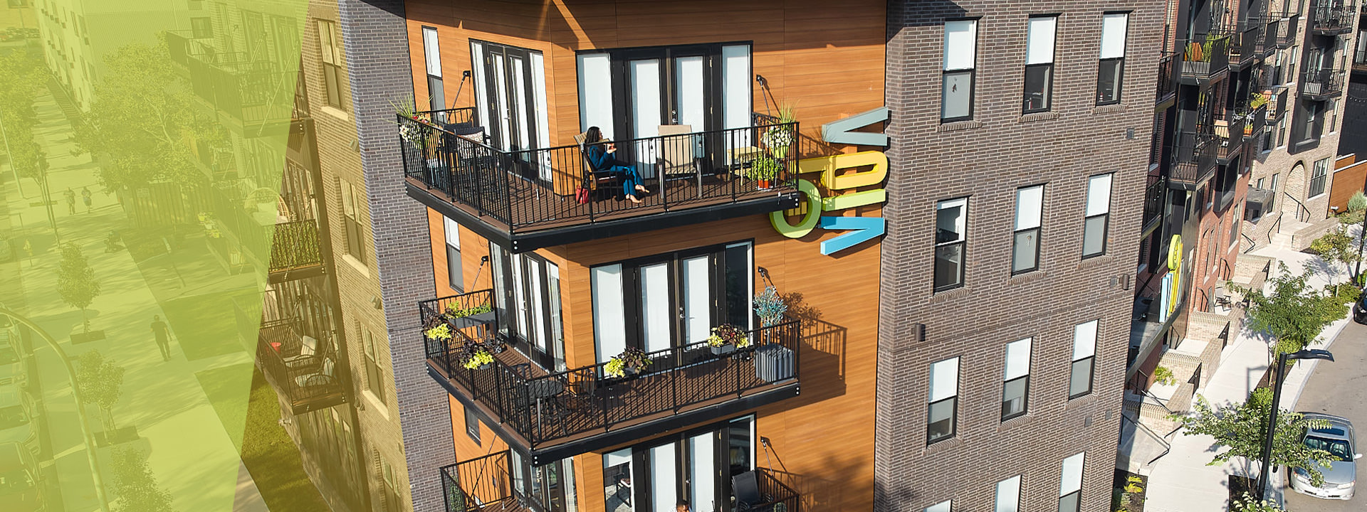 VIDA Rochester, person sitting on a balcony